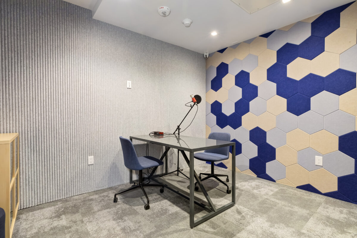 Studio room with a table, office chairs and mic
