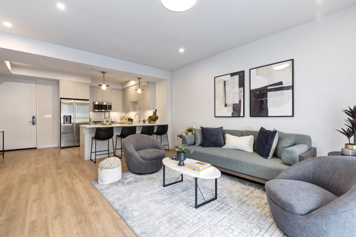 living room with modern decor and view of kitchen