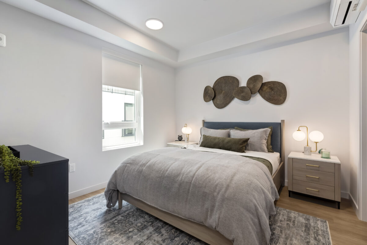 bedroom with modern decor and large window